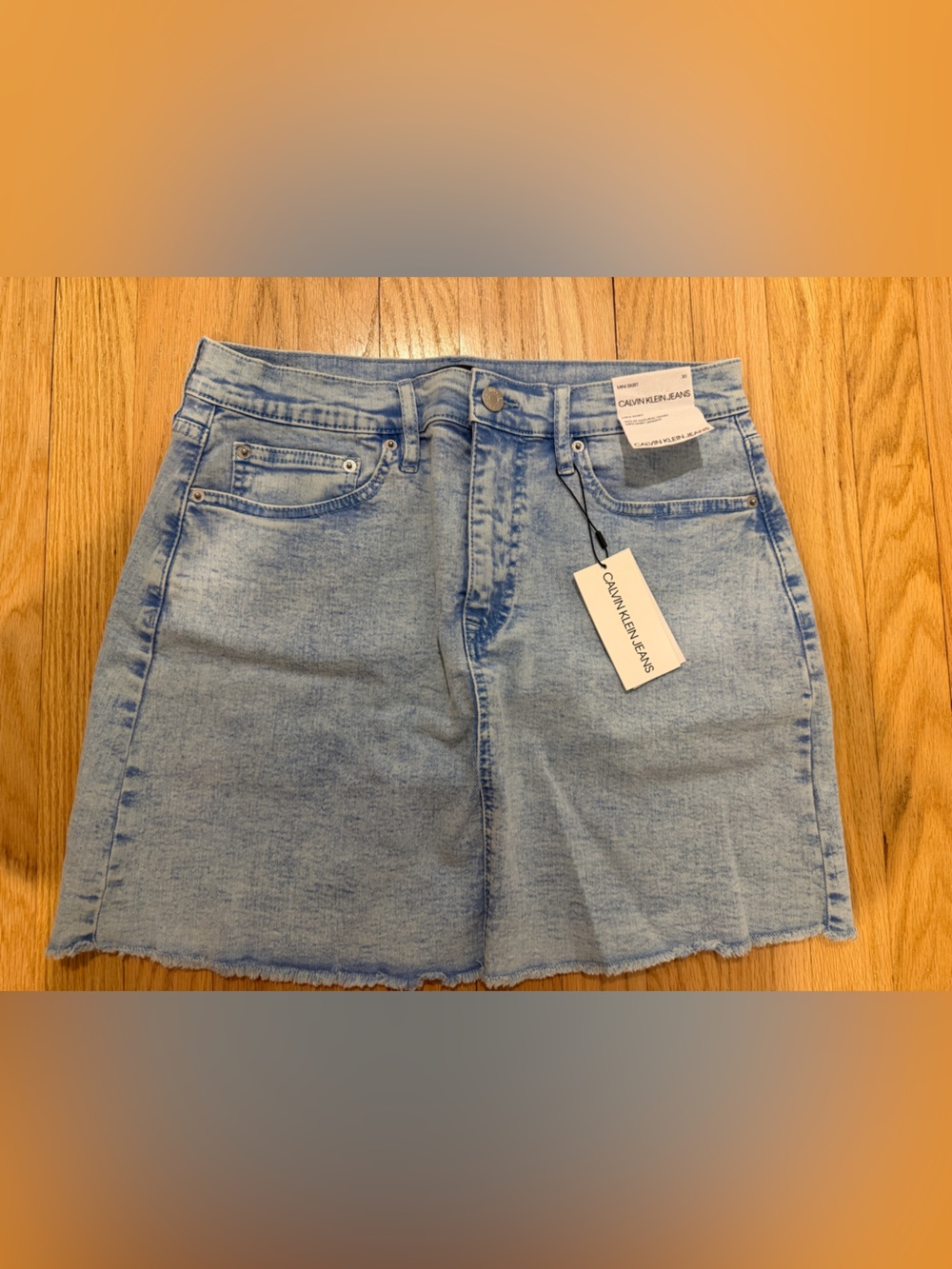 Calvin Klein Light Blue Denim Mini Skirt with Raw Hem